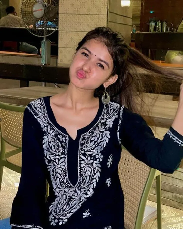 A young woman with a playful expression.